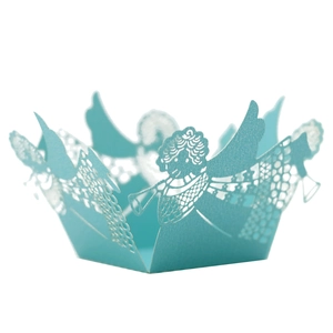 Close-up of laser-cut light blue candy box featuring intricate angel with horn patterns