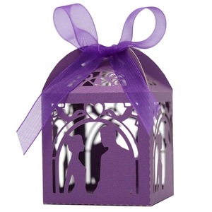 Laser-cut dark purple wedding favor box with bride and groom silhouette and ribbon