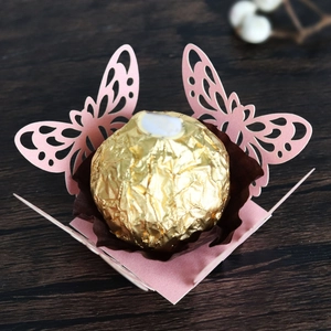 Detailed laser-cut hollow butterfly candy box in pink for wedding chocolate decor