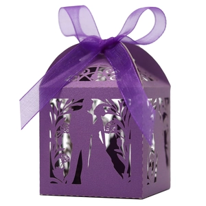 Detailed laser-cut bride and groom silhouette on a purple wedding gift favor box