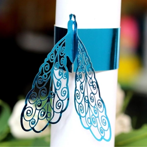 Laser-cut peacock napkin ring in bright blue for wedding and banquet table decor