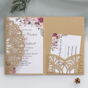 Elegant laser cut wedding invitation set with champagne gold cover and floral main cards