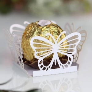 Detailed laser cut white butterfly chocolate wrapper with elegant hollow paper pattern