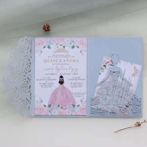 Macro detail of laser-cut rose hollow pocket and printed floral Quinceañera invitation card