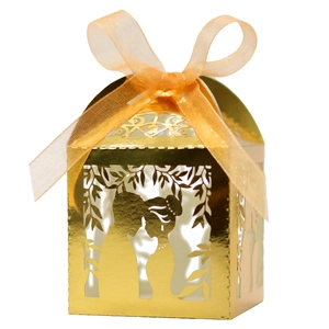 Golden laser-cut wedding candy box with bride and groom design and orange ribbon bow