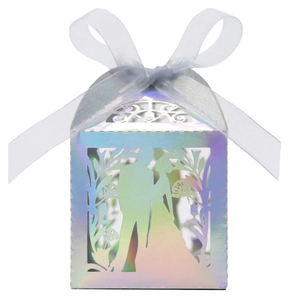Laser-cut wedding favor box with holographic finish and ribbon bow detail