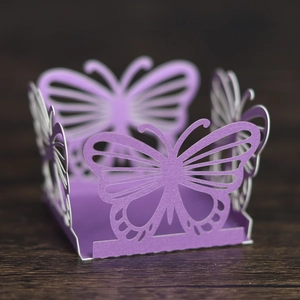Detailed laser-cut lavender purple butterfly candy box with hollow patterns for parties