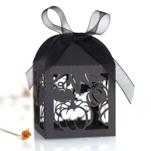 Detailed laser-cut black pumpkin hollow gift box with elegant matching ribbon bow