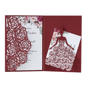 Burgundy laser-cut rose wedding invitation with floral insert card on white background