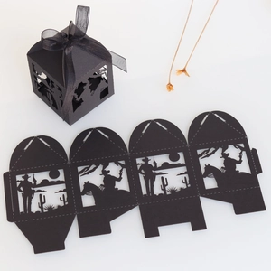 Laser-cut black cowboy party candy box with horse silhouette and black organza ribbon