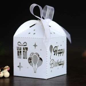 Detailed laser-cut Happy Birthday gift box in white with balloon motifs and ribbon