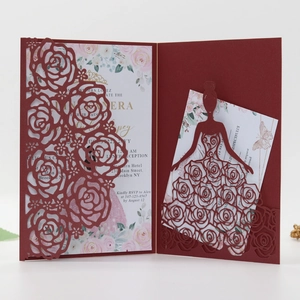 Detailed close-up of dark red laser-cut rose hollow invitation with elegant inner cards