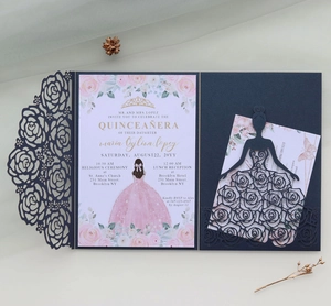 Detailed laser-cut navy rose pocket with floral Quinceañera invitation on premium pearlescent paper