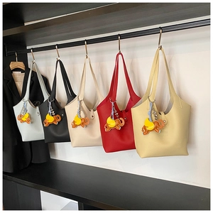 Selection of colorful large-capacity tote bags with elephant charms in five vibrant shades