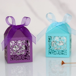 Detailed laser-cut LOVE candy boxes in purple and light blue with satin ribbon bows