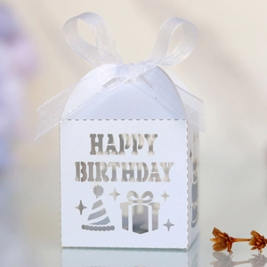 Detailed laser-cut Happy Birthday candy box with white cardstock and sheer ribbon bow