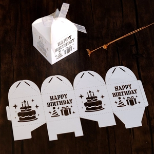 Detail showing flat-pack and assembled white laser-cut Happy Birthday candy gift boxes