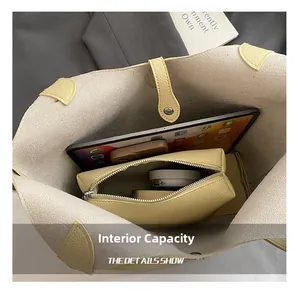 Internal capacity of the large tote bag showing space for tablet and makeup bag