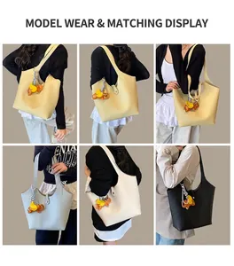 Detailed model shots of minimalist tote bag in four colors with elephant charm