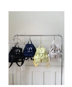 Detailed comparison of nylon backpacks in black, navy, yellow, and grey with rivet accents