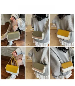 Detail view of vintage flap square bag showing accordion gusset and two-tone color block design