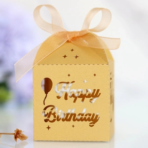 Detail of golden hollow Happy Birthday candy box with ribbon for birthday celebrations