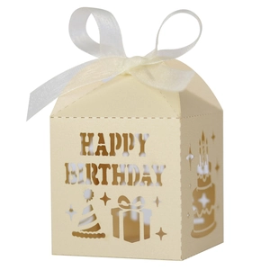 Detail of cream laser-cut Happy Birthday candy box with elegant organza ribbon tie