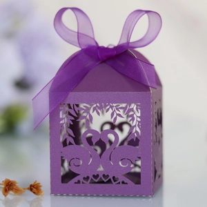 Detailed laser-cut purple swan gift box with heart shapes and matching organza ribbon