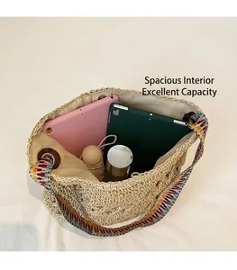 Top view of large straw tote bag showing spacious interior with tablet and umbrella