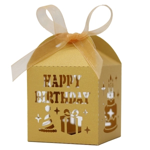 Detail of laser-cut gold Happy Birthday candy box with ribbon and hollow pattern