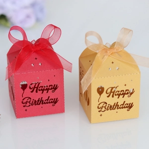 Detail of laser-cut Happy Birthday hollow candy boxes with elegant organza ribbons