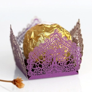 Elegant purple laser-cut candy box with intricate tree patterns for wedding party decor
