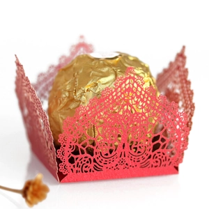 Red laser-cut hollow candy box with intricate lace pattern for wedding party favors