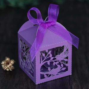 Detailed laser cut purple gift box featuring intricate bird and flower patterns with ribbon