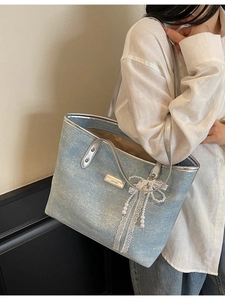 Light blue faux leather tote bag with lace bow and pearl charm for commuting