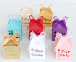 Detailed laser-cut Happy Birthday candy boxes with ribbon bows and balloon cutouts