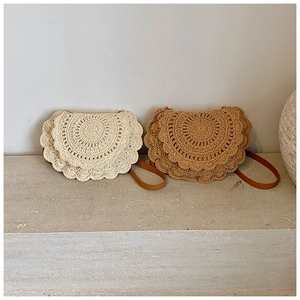 Detail of woven saddle bags with artisanal knit texture and premium leather straps