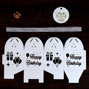 White laser-cut Happy Birthday gift box with silver ribbon, thank you tag and golden flower