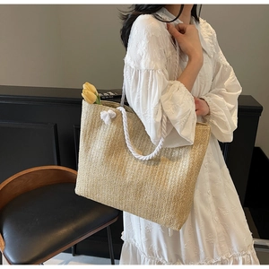 Fashion straw tote bag with white rope handles and tulips for a vacation lifestyle