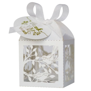 Detailed laser-cut wedding gift box with bird pattern, white ribbon, and thank you tag