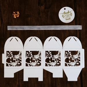 Laser cut favor box with love birds pattern, silver ribbon and thank you tag detail