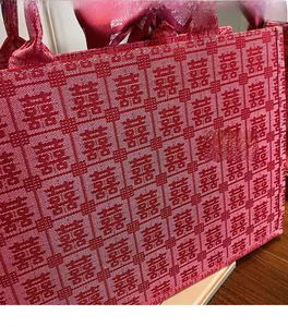 Detail of red jacquard wedding tote bag with traditional Chinese Double Happiness patterns