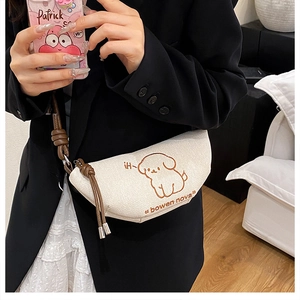 Illustration de chiot sur sac croissant en toile beige avec bandoulière brune
