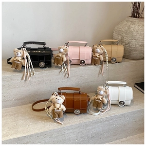 Detailed view of high-gloss mini pillow bags in five colors with cute bear pendants