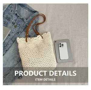 Detail of hand-crocheted beige tote bag with scalloped edges and brown leather straps