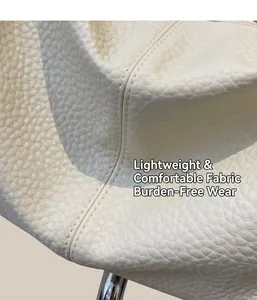 Close-up of off-white lychee grain PU leather with precise double-stitch sewing detail