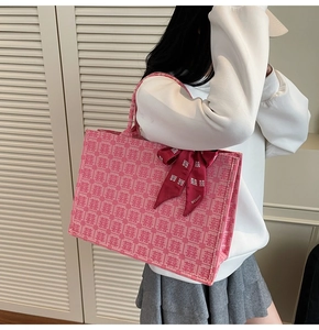 Detail of pink bridal tote bag with red Double Happiness silk scarf and festive print