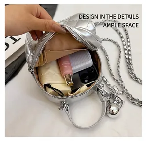 Interior storage space of a quilted silver chain bag showing capacity for daily essentials