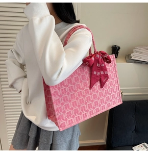 Detail of pink bridal tote bag with red Double Happiness embroidery and scarf