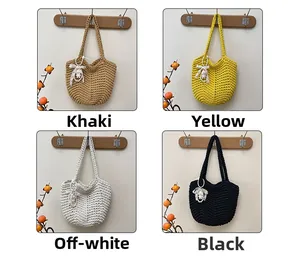 Close-up of four colors of woven tote bags featuring lace bows and doll charms